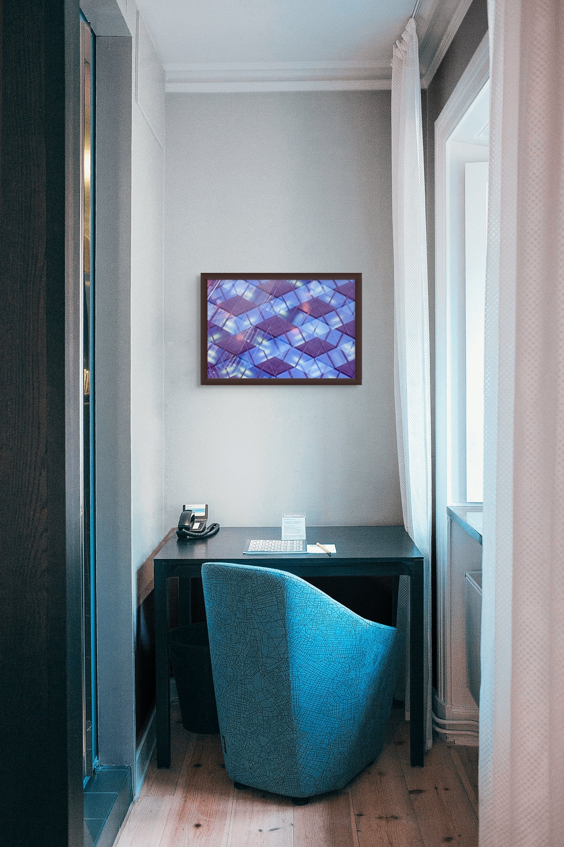 Abstract photo of an office building in Oslo, Norway. It's hanging on the wall of a small hotel office.