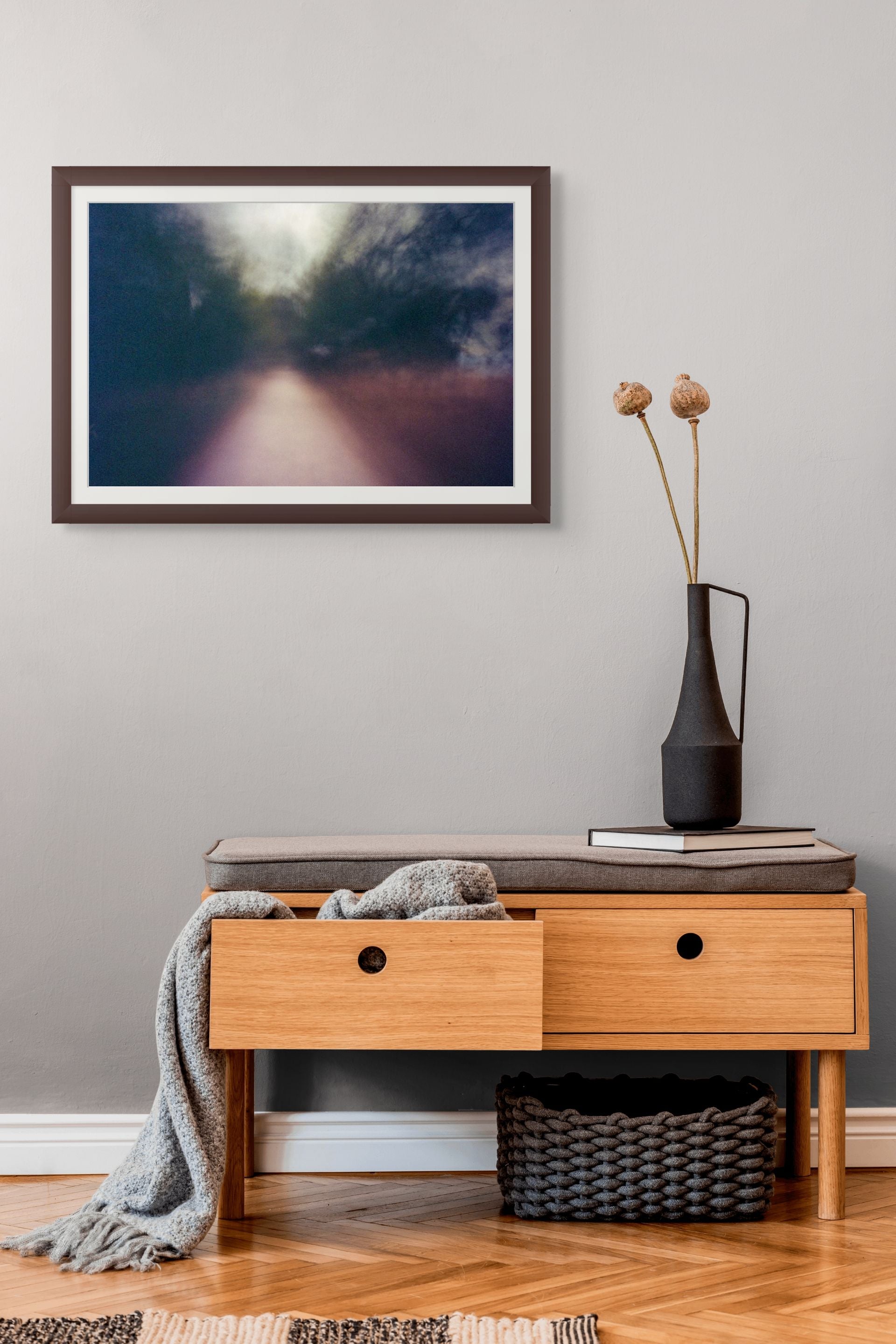 An abstract fine art photo of a blurry path in Athens, Greece, framed and hanging on the wall of a modern interior.