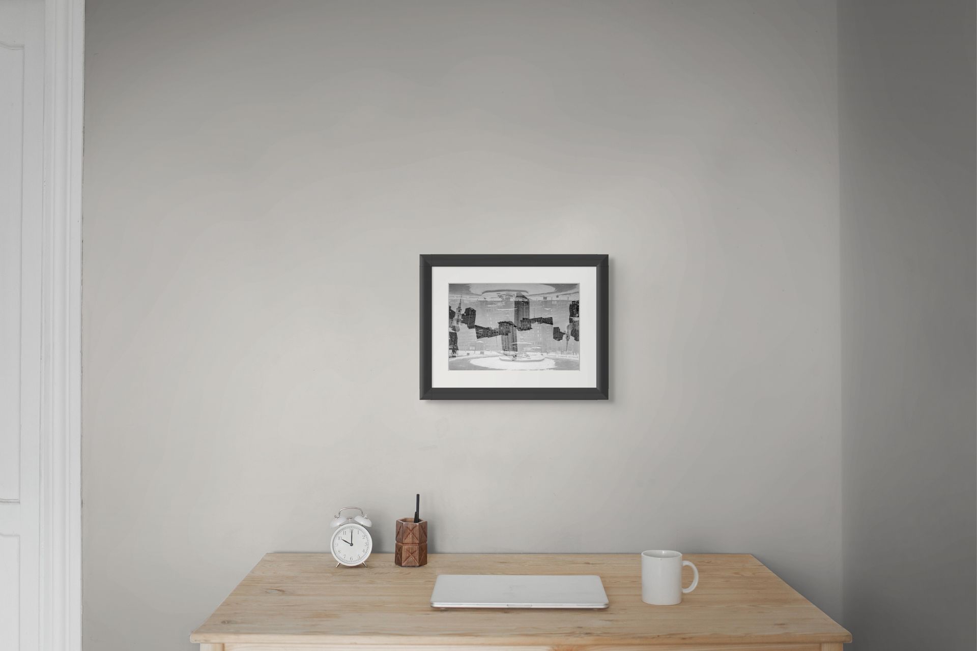 Cool, modern black and white photo print in a home office setting.
