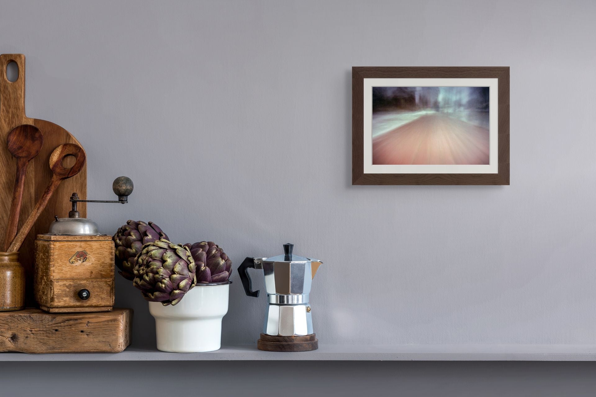 Fine art print on giclee paper of an abstract scene, hung on a wall of a kitchen interior.