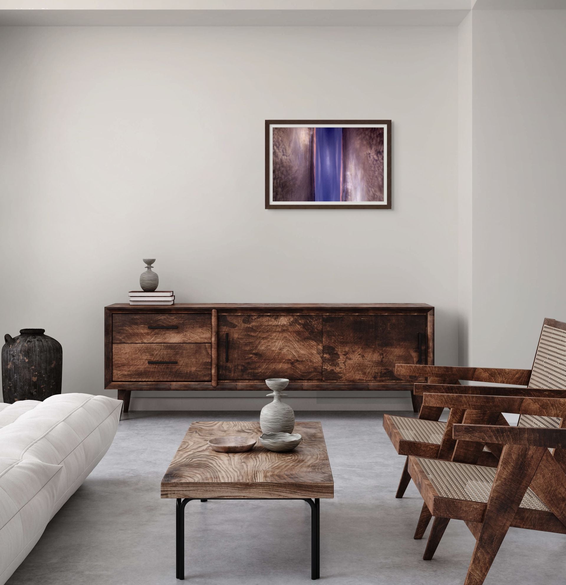 Abstract fine art photograph of a double exposure of a sky with clouds, framed and hung on the wall to complement the decor.