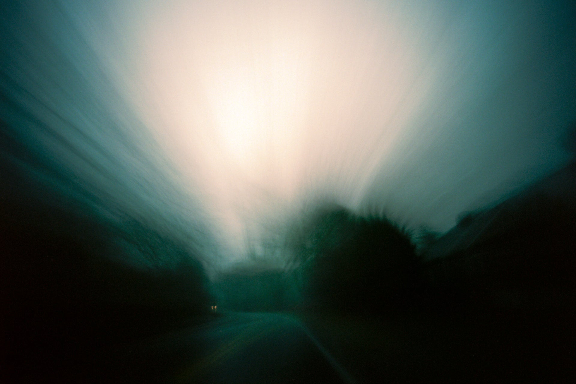A fine art print of abstract long exposures photographs done at dusk on the road.