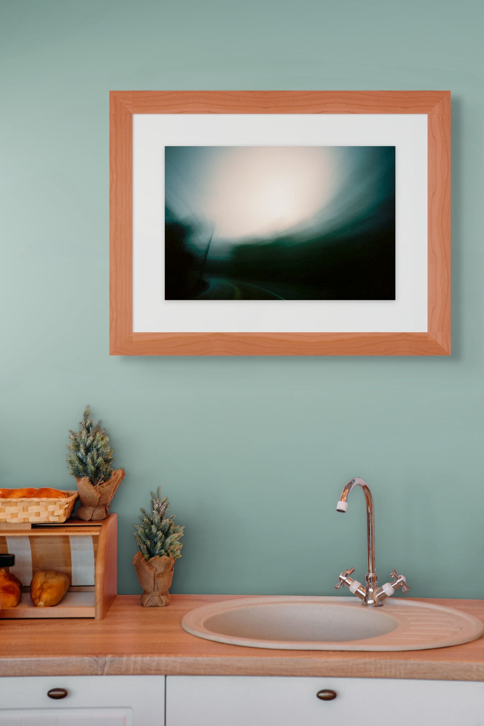 Green and black abstract photo of a road at dusk, framed and printed on high quality giclee paper in a perfectly designed room.