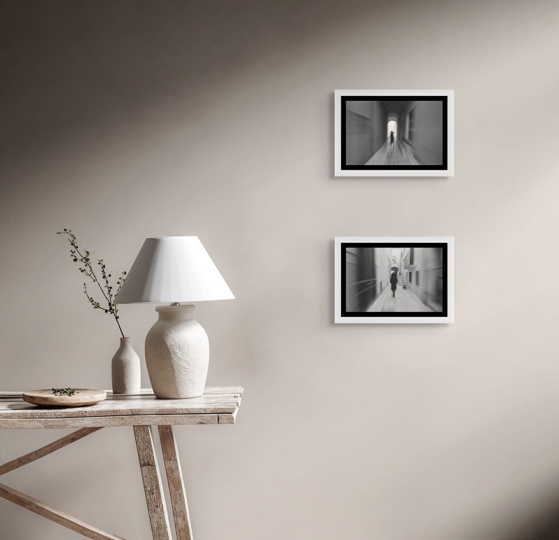 A fine art black and white photo print, framed and hanging on the wall of a modern interior.