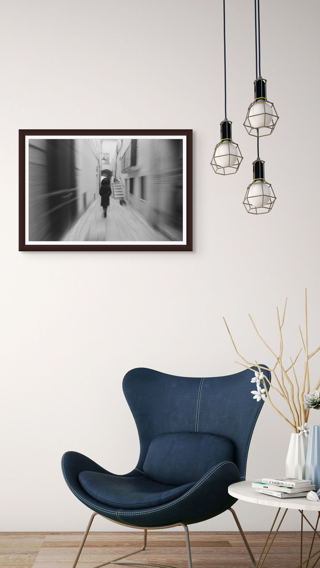 A fine art black and white photo print, framed and hanging on the wall of a modern interior.