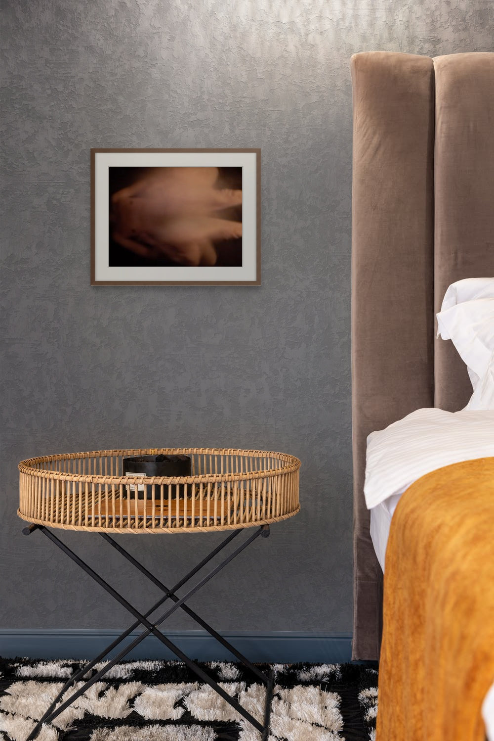 Impressionistic photo of sex in the abstract, printed on fine art giclee paper and hanging on a wall of a bedroom.