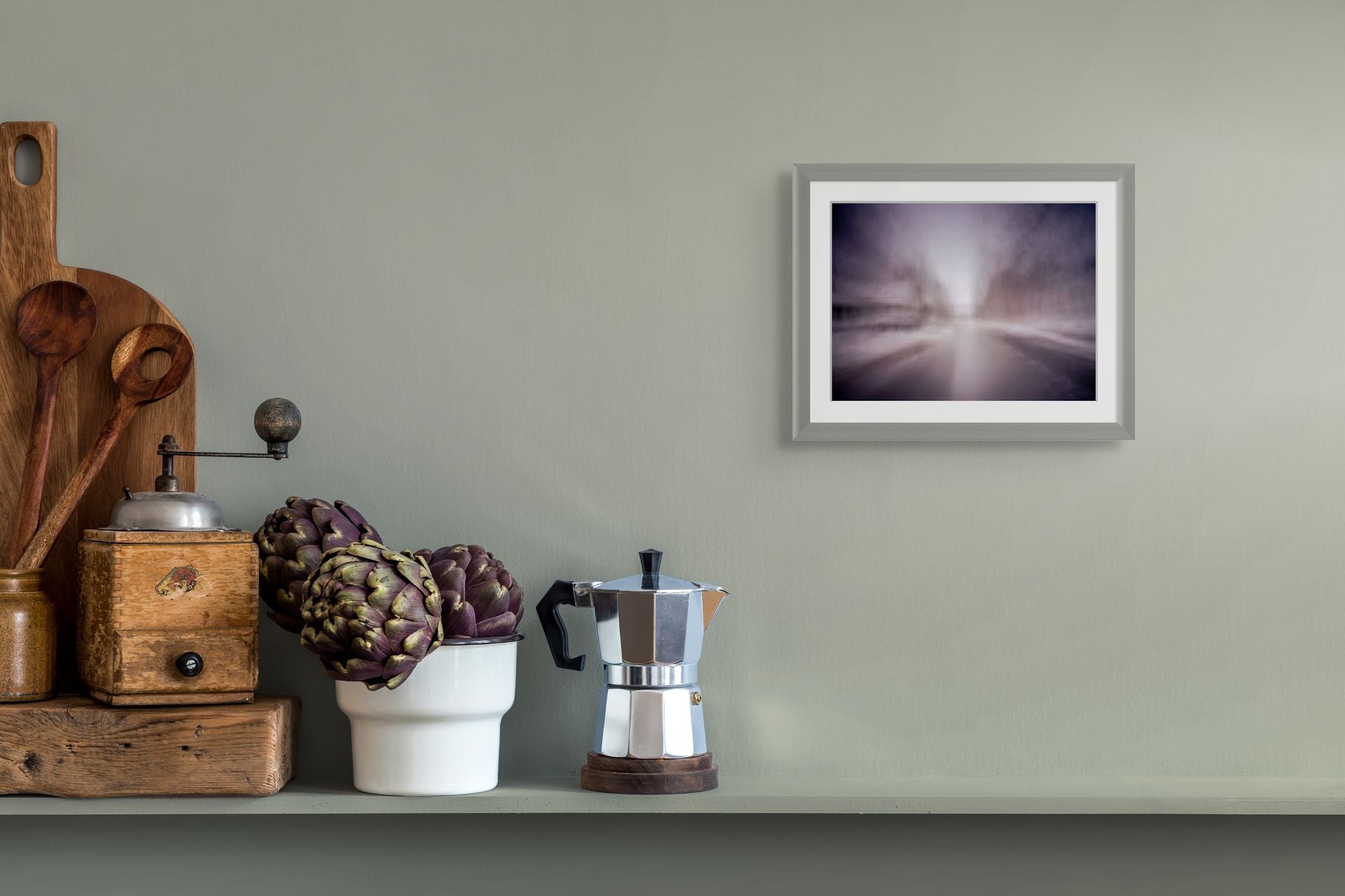 An abstract fine art print of a snowy landscape, framed and hung on the wall of a modern space.