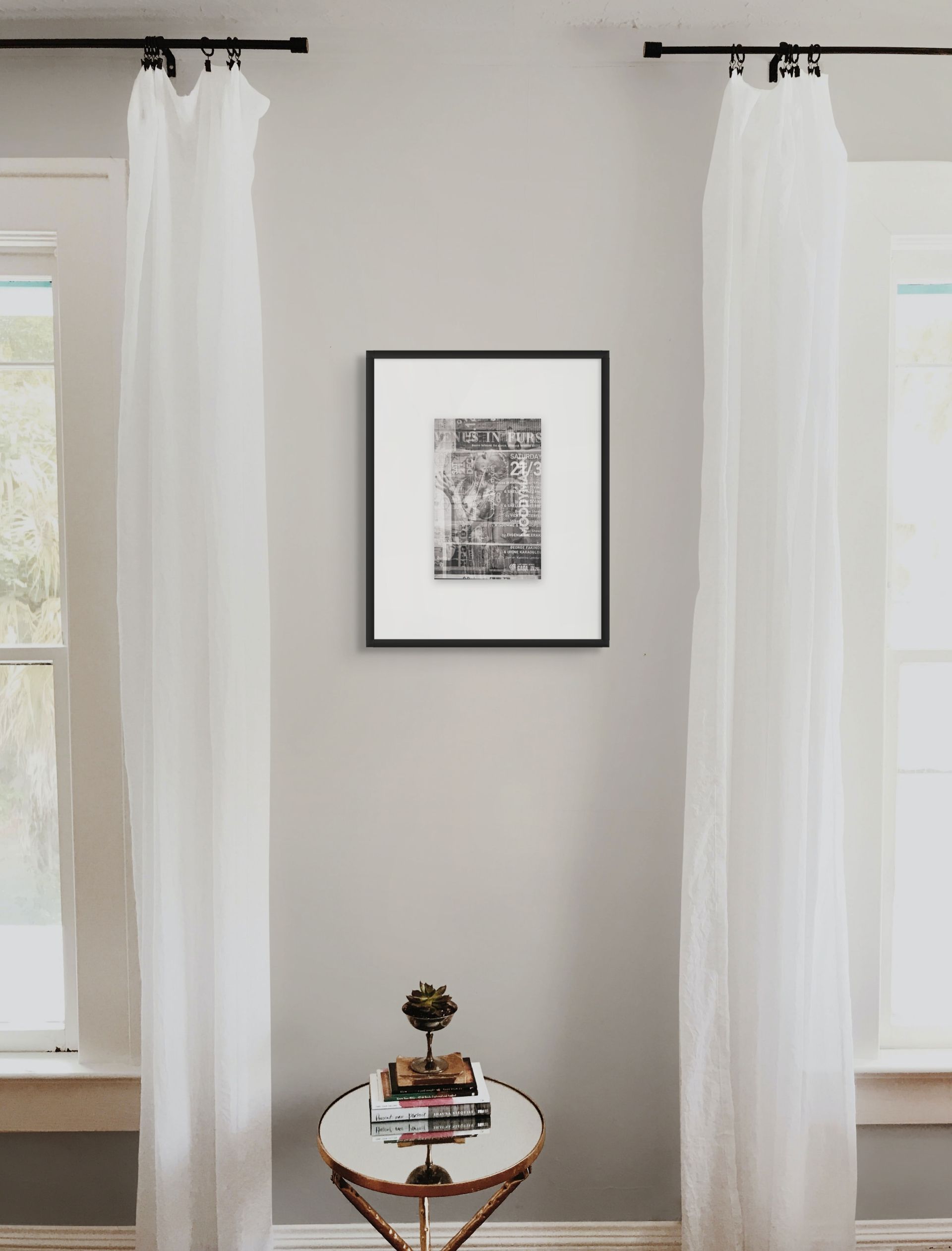 Abstract fine art photo print in black and white, hanging on the wall of a classic living room.