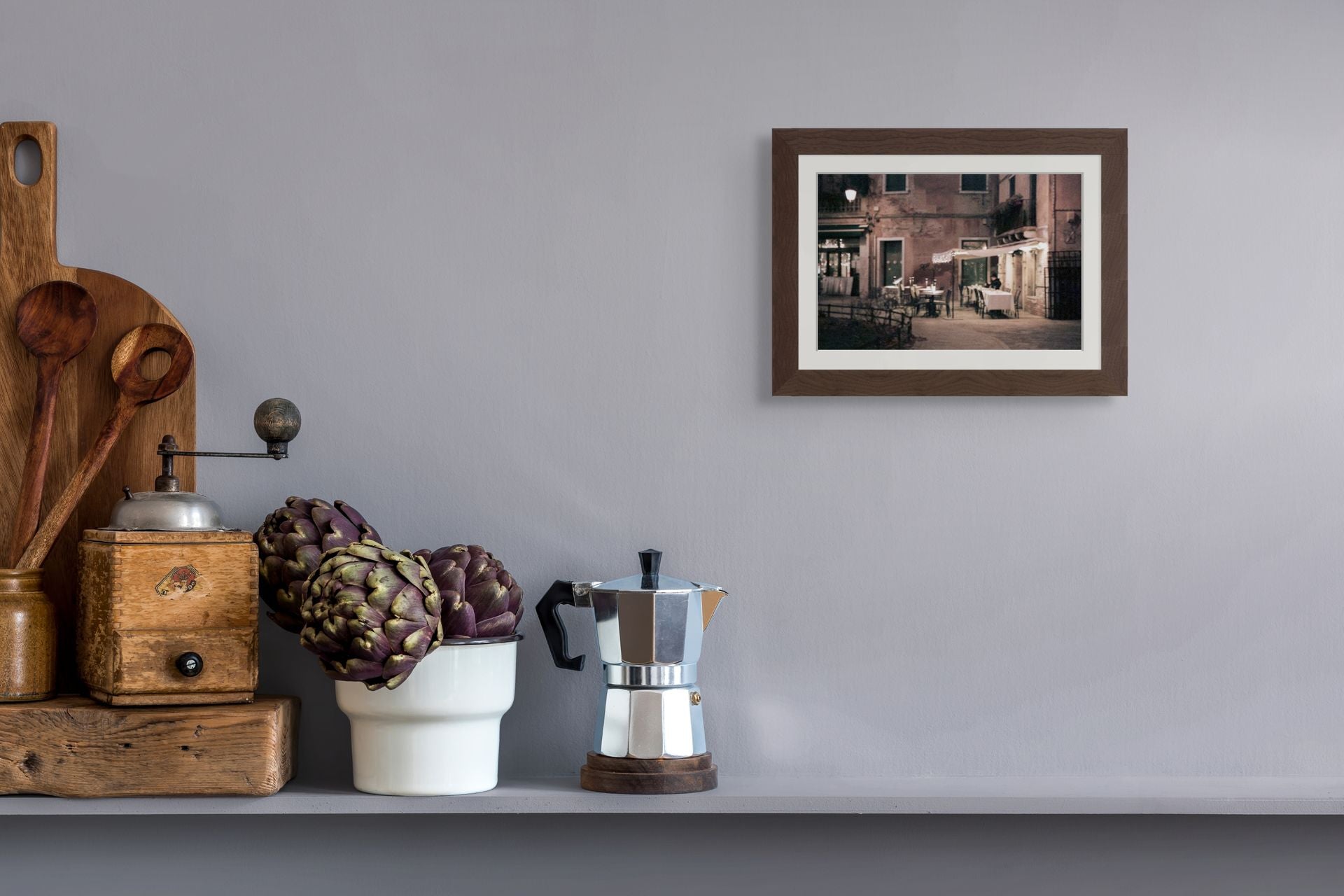 Kitchen interior with a framed fine art print of Venice at night. The picture is an abstract photo on giclee paper.