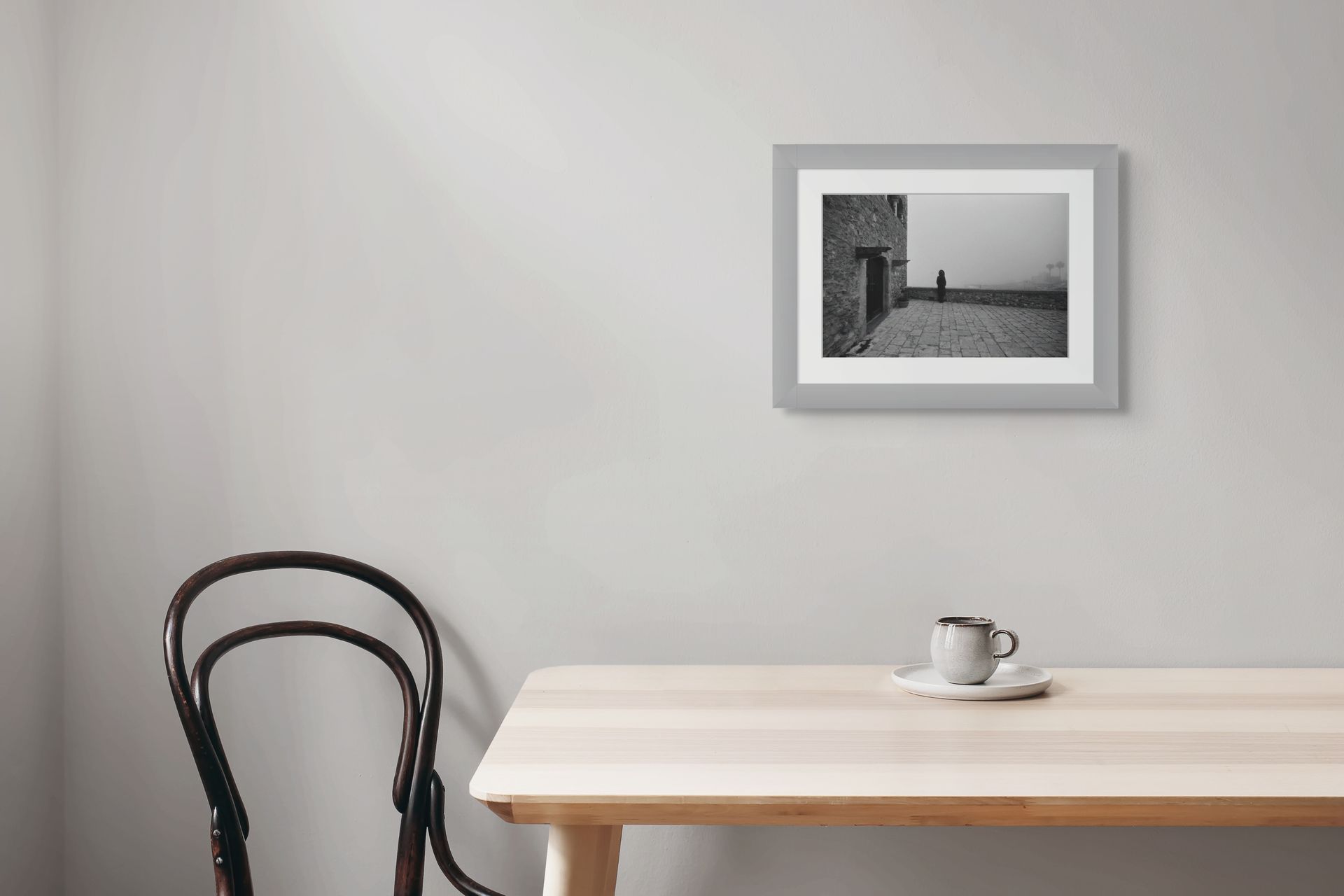 A misty fine art photo print on black and white ilford photo paper set in a modern kitchen scene.